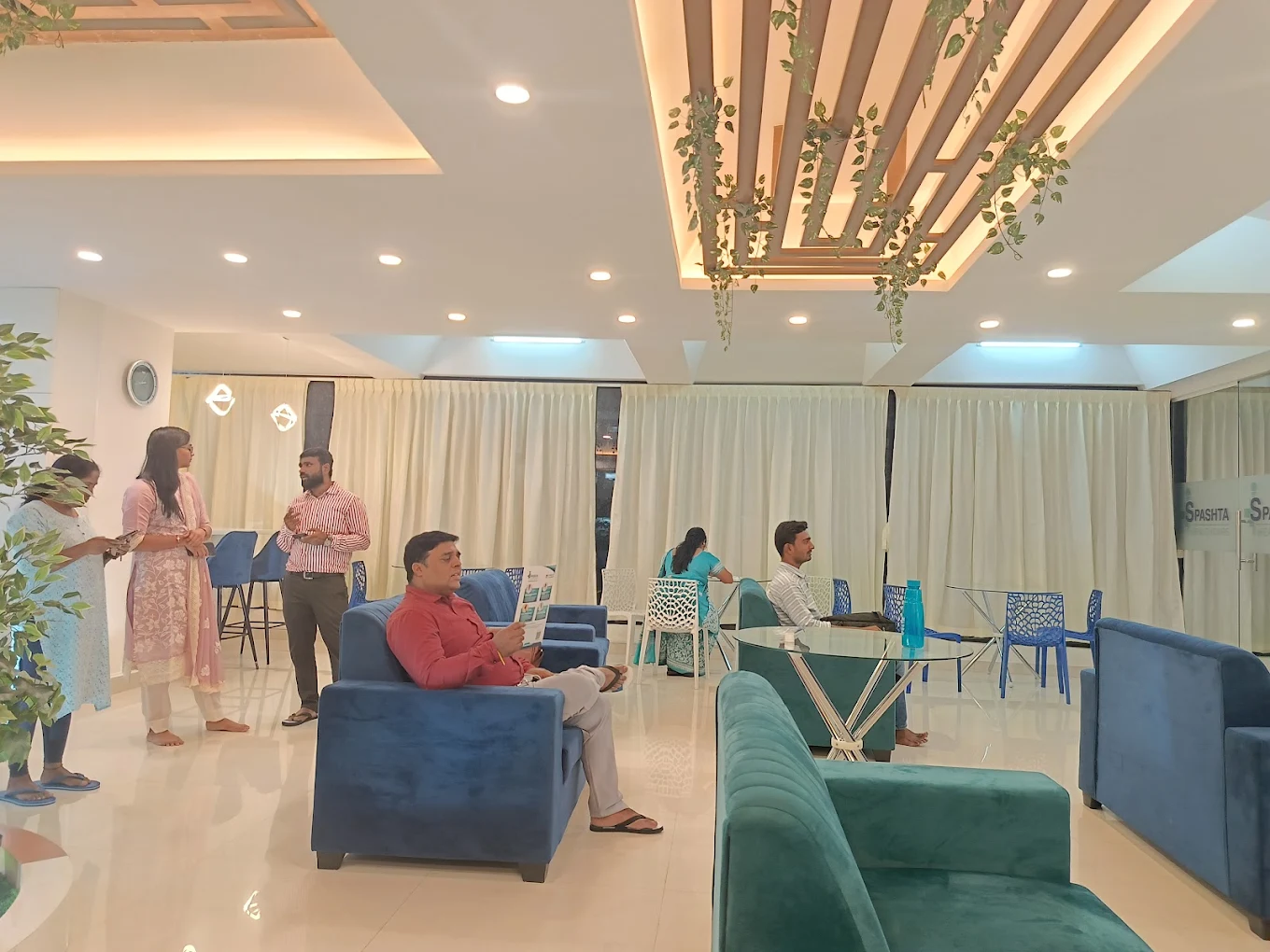Patients and families in the waiting lounge at Spashta Healthcare, Bengaluru
